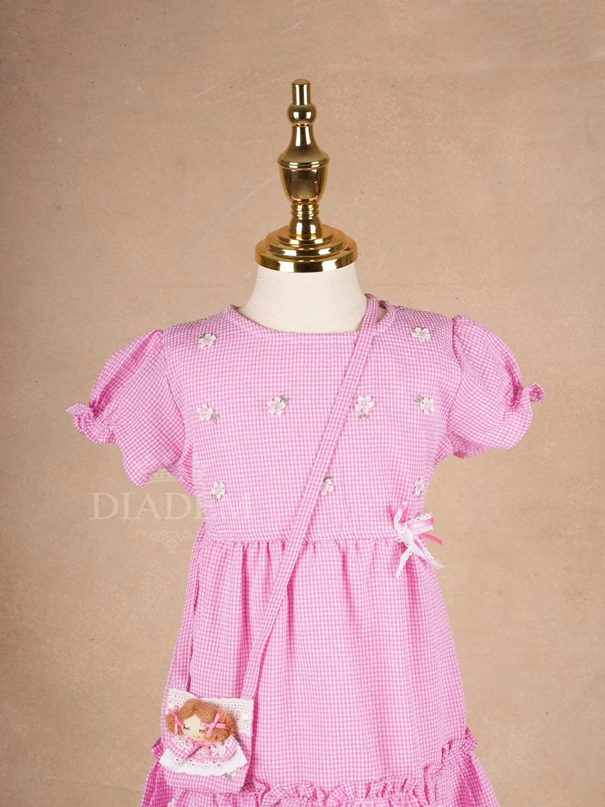 Pale Pink Cotton Frock Adorned with Floral and Small Checks Designs Girls