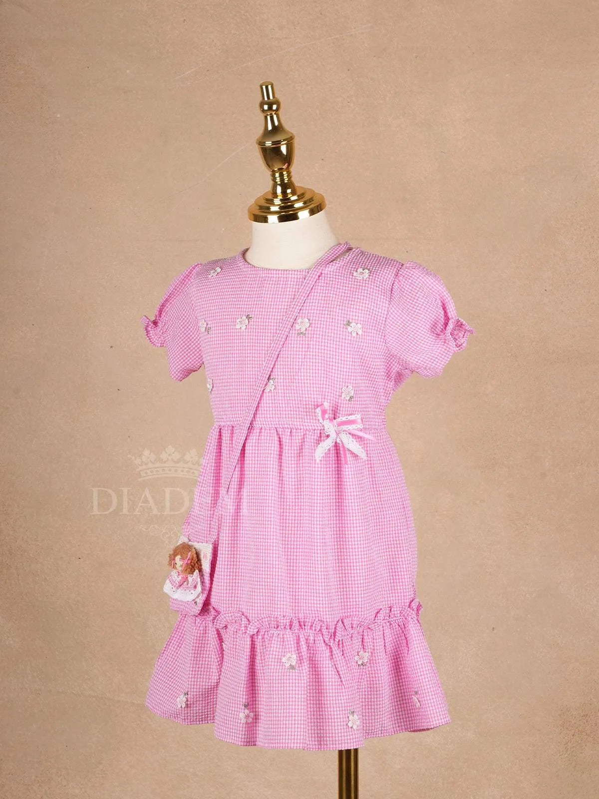 Pale Pink Cotton Frock Adorned with Floral and Small Checks Designs Girls