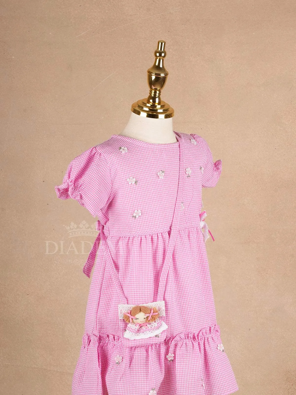 Pale Pink Cotton Frock Adorned with Floral and Small Checks Designs Girls