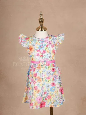 White Frock Adorned with Colorful Floral Designs and Cap Sleeve for Girls