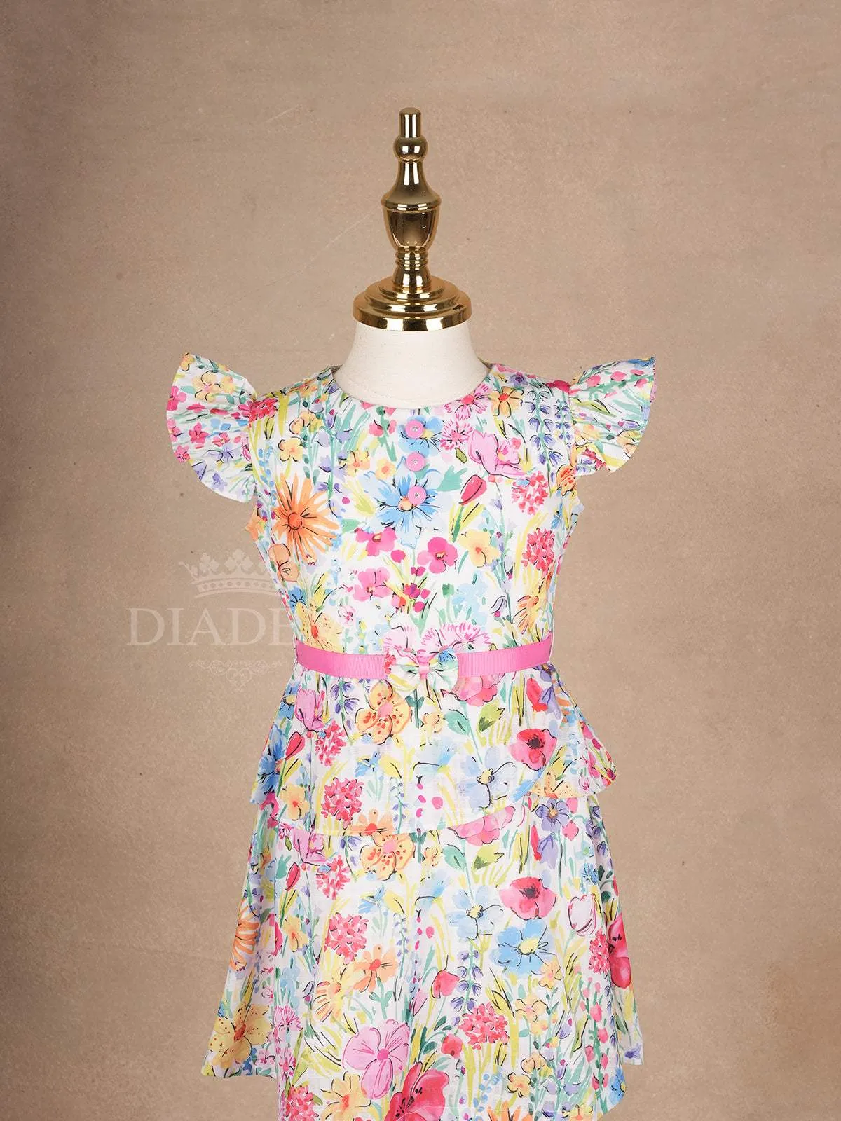 White Frock Adorned with Colorful Floral Designs and Cap Sleeve for Girls