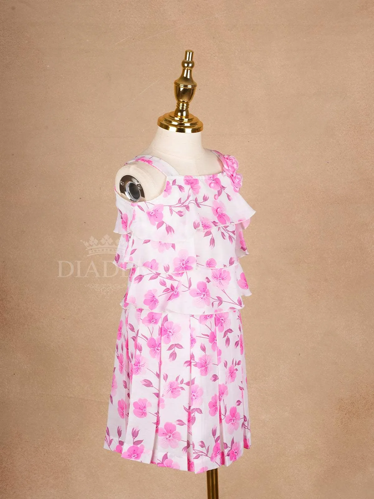 White Frock Adorned with Floral Designs and Sleeveless for Girls