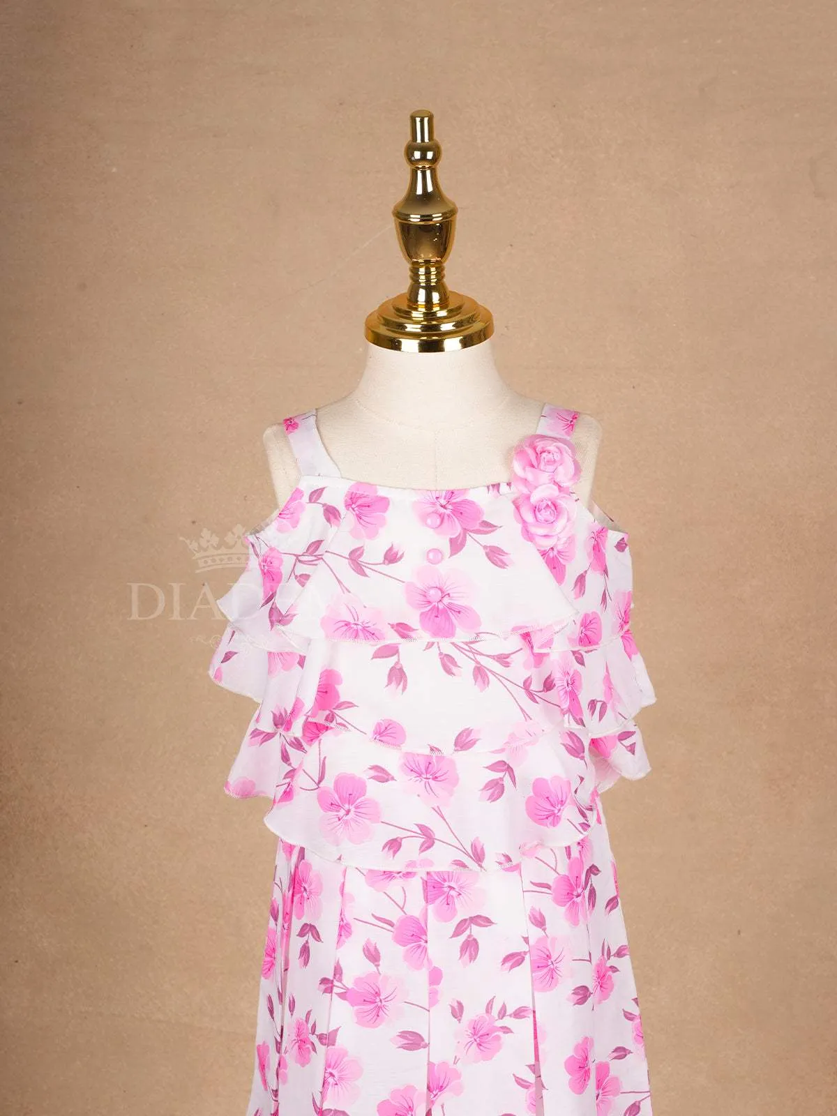 White Frock Adorned with Floral Designs and Sleeveless for Girls